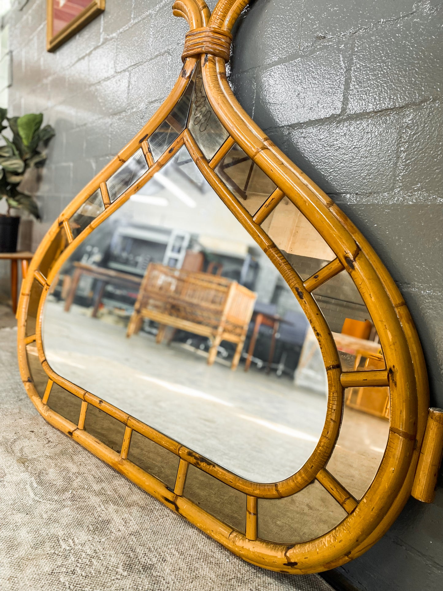 Vintage Cane Mirror with Bali accents.