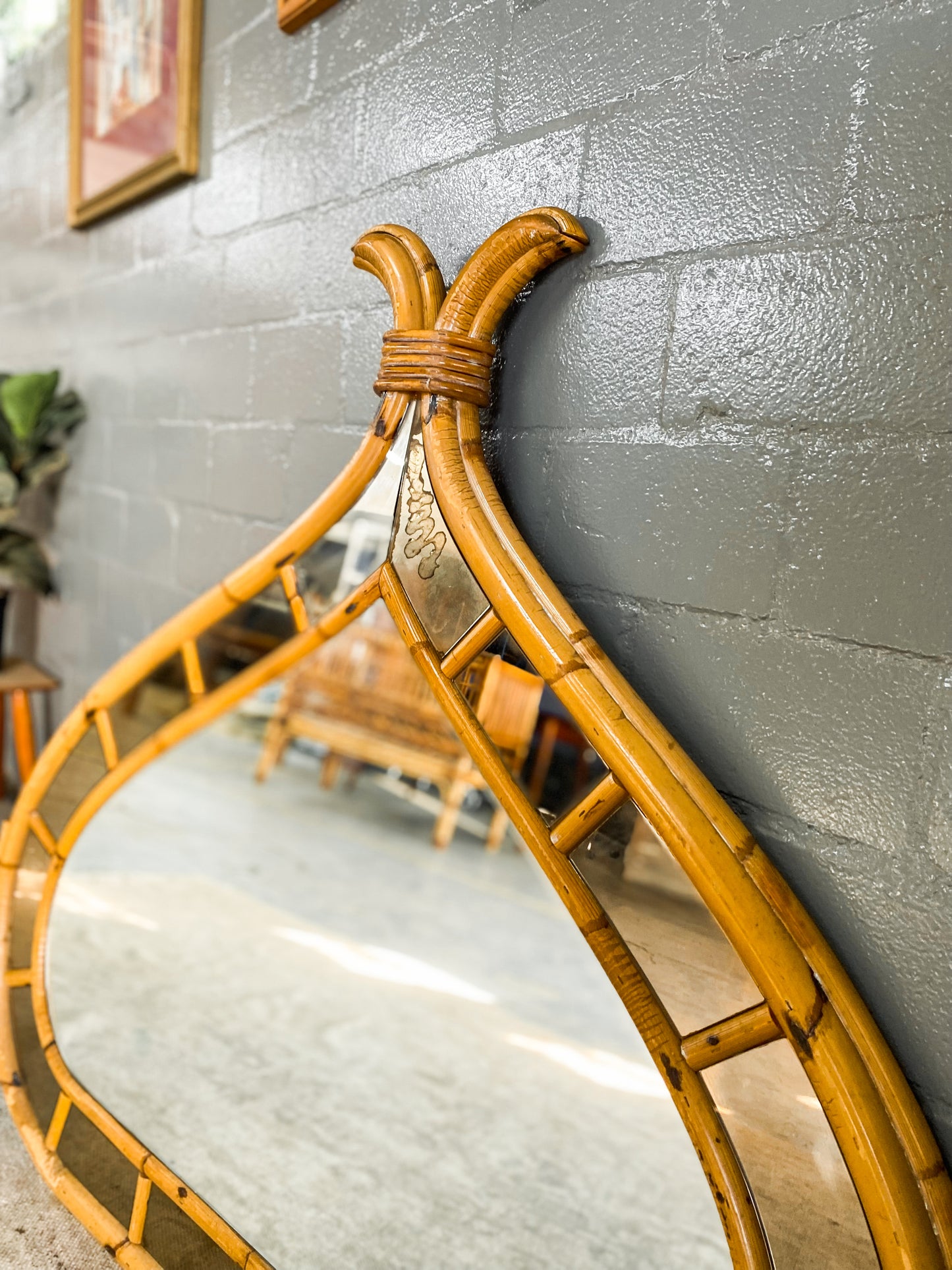 Vintage Cane Mirror with Bali accents.