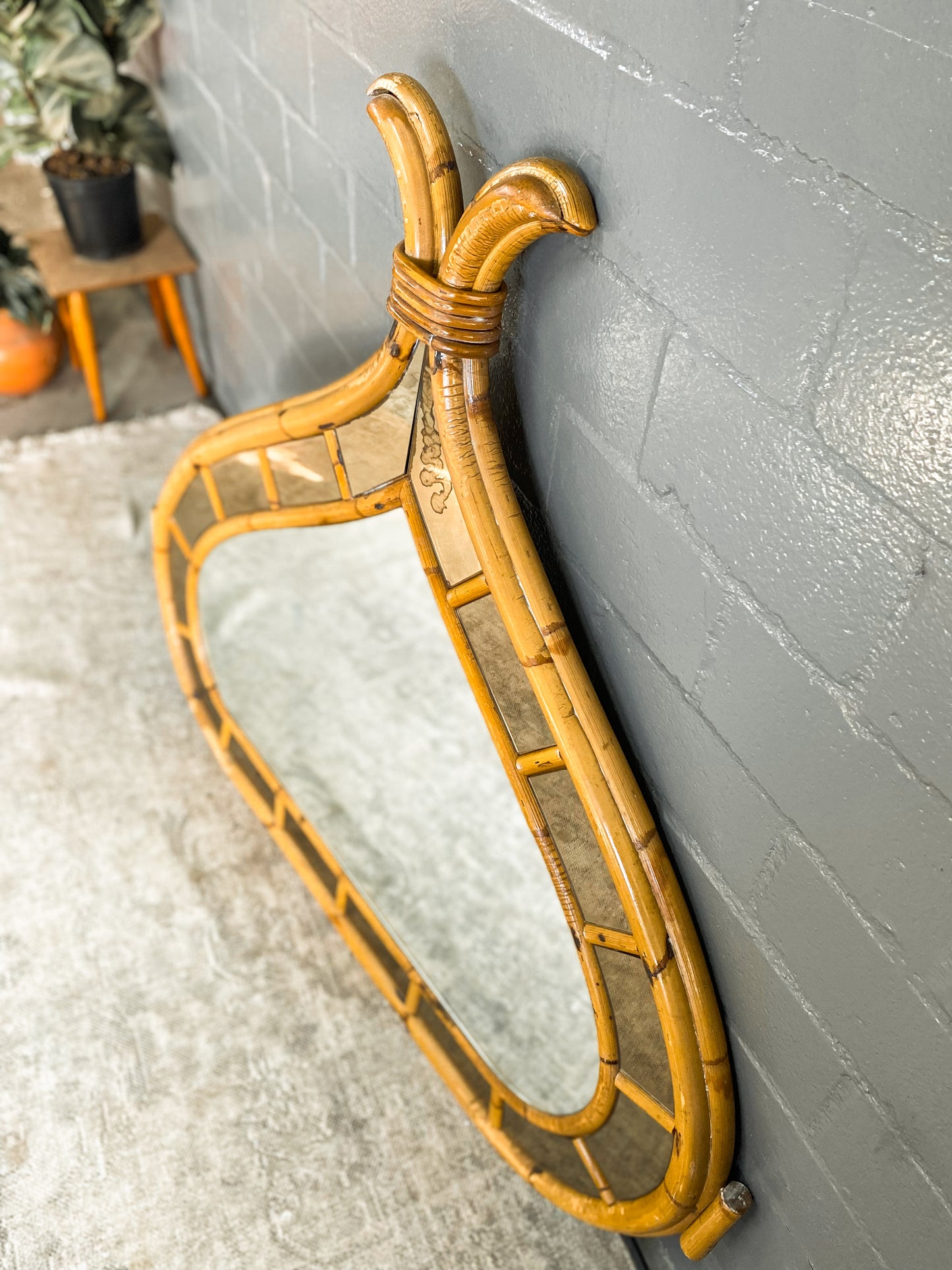 Vintage Cane Mirror with Bali accents.