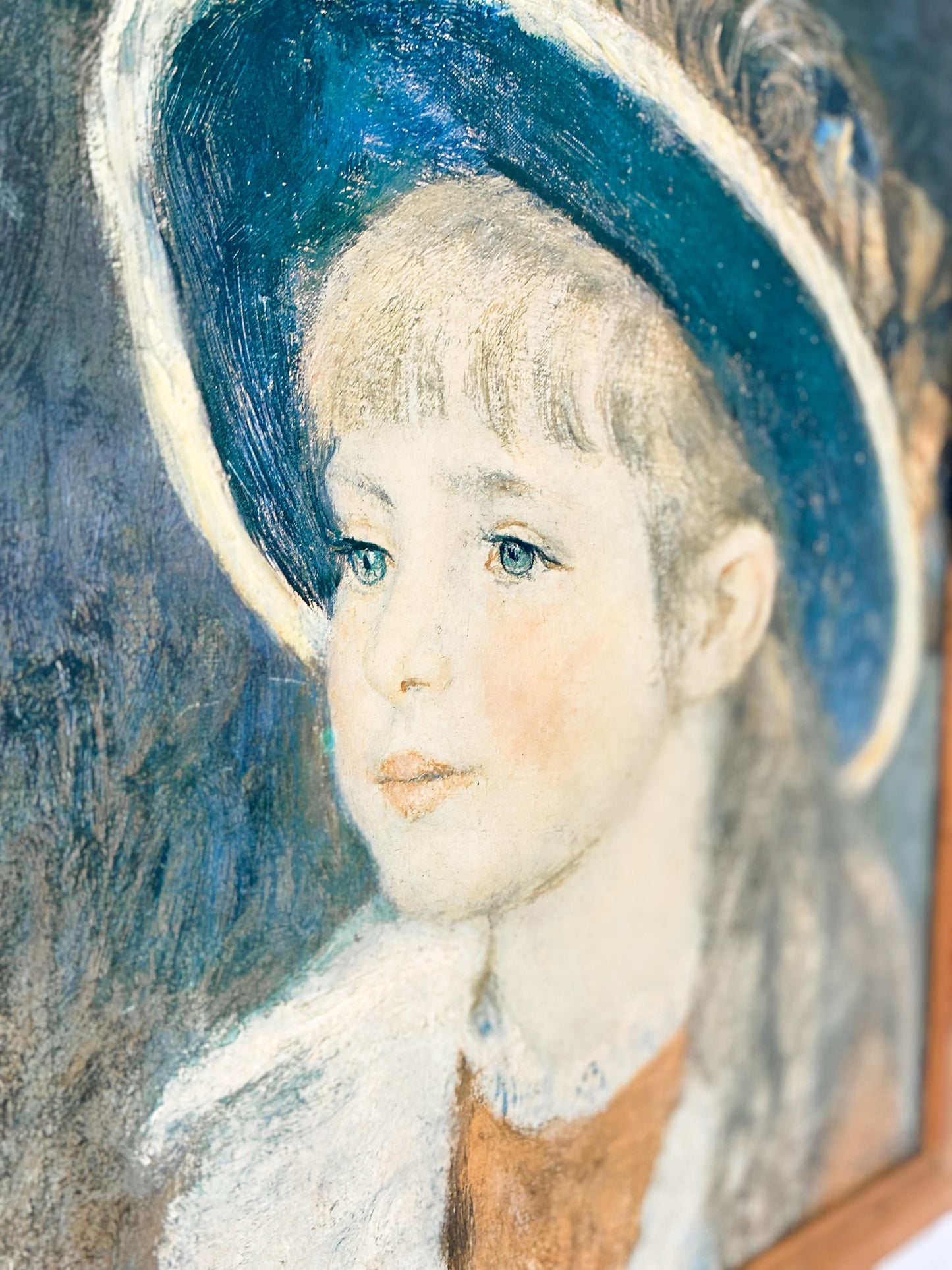 Piere-Auguste Renoir print "Portrait of a Young Girl in a Blue Hat" in wooden frame.