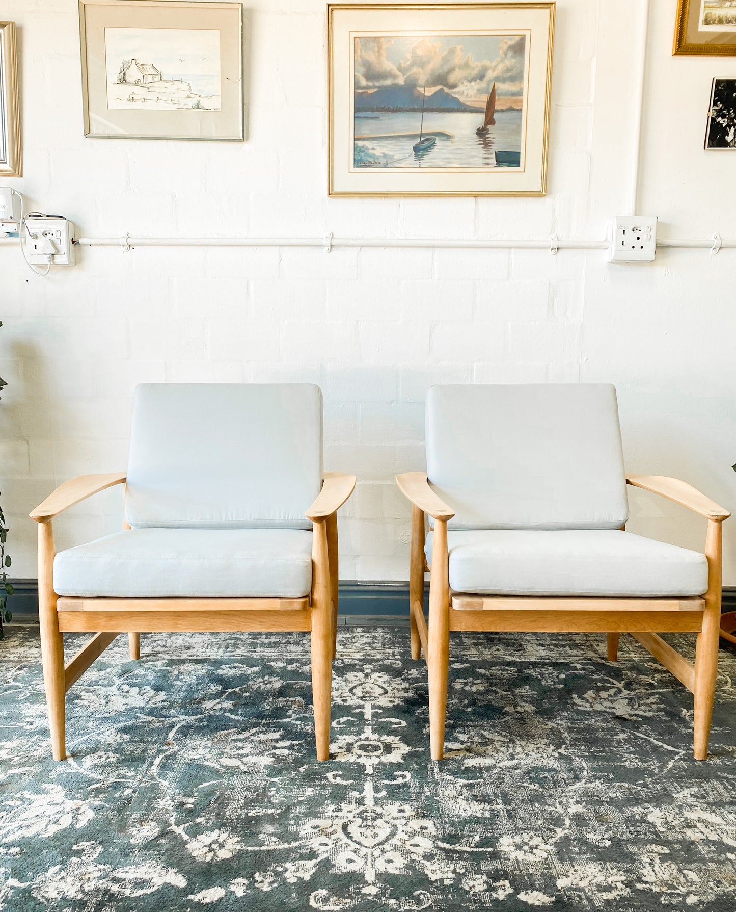 Pair of Swedish Armchairs Featuring Cool Blue Upholstered Cushions.
