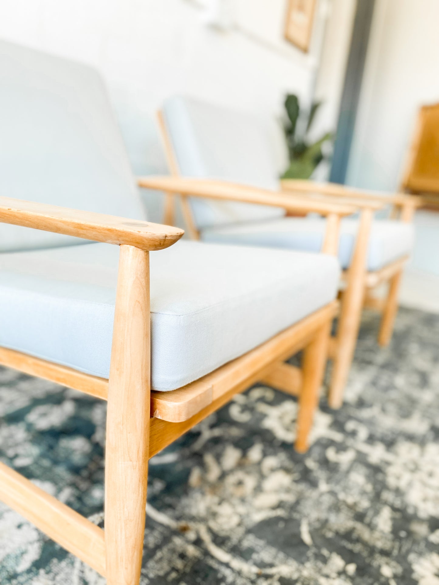 Pair of Swedish Armchairs Featuring Cool Blue Upholstered Cushions.