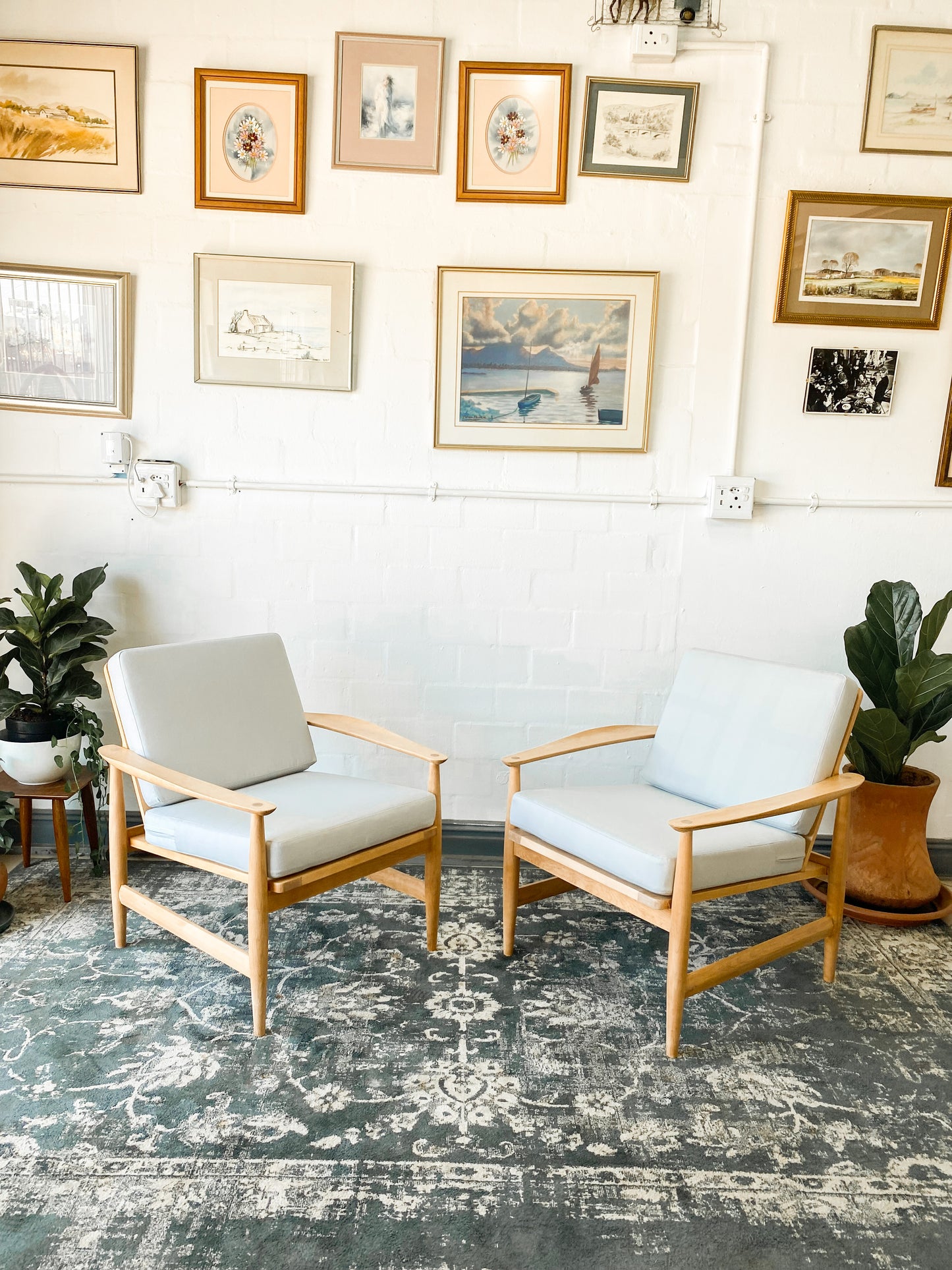 Pair of Swedish Armchairs Featuring Cool Blue Upholstered Cushions.