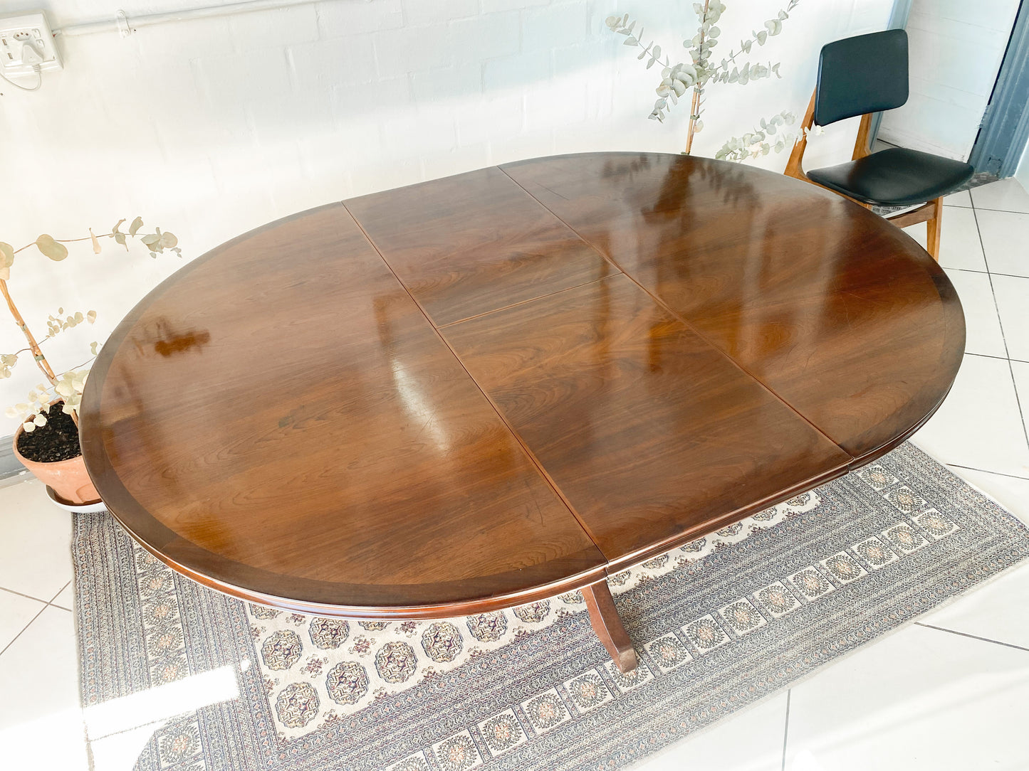 Elegant Extendable Imbuia 6-8 seat dining table made by premium South African designer EE Meyer.
