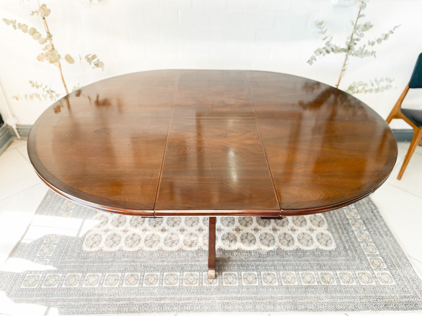 Elegant Extendable Imbuia 6-8 seat dining table made by premium South African designer EE Meyer.
