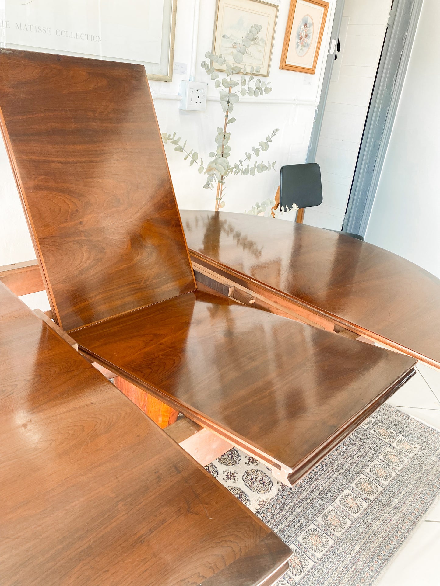Elegant Extendable Imbuia 6-8 seat dining table made by premium South African designer EE Meyer.