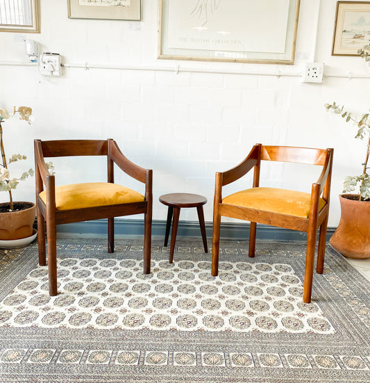Set of two solid wood Mid-Century Modern Arm Chairs and side table.