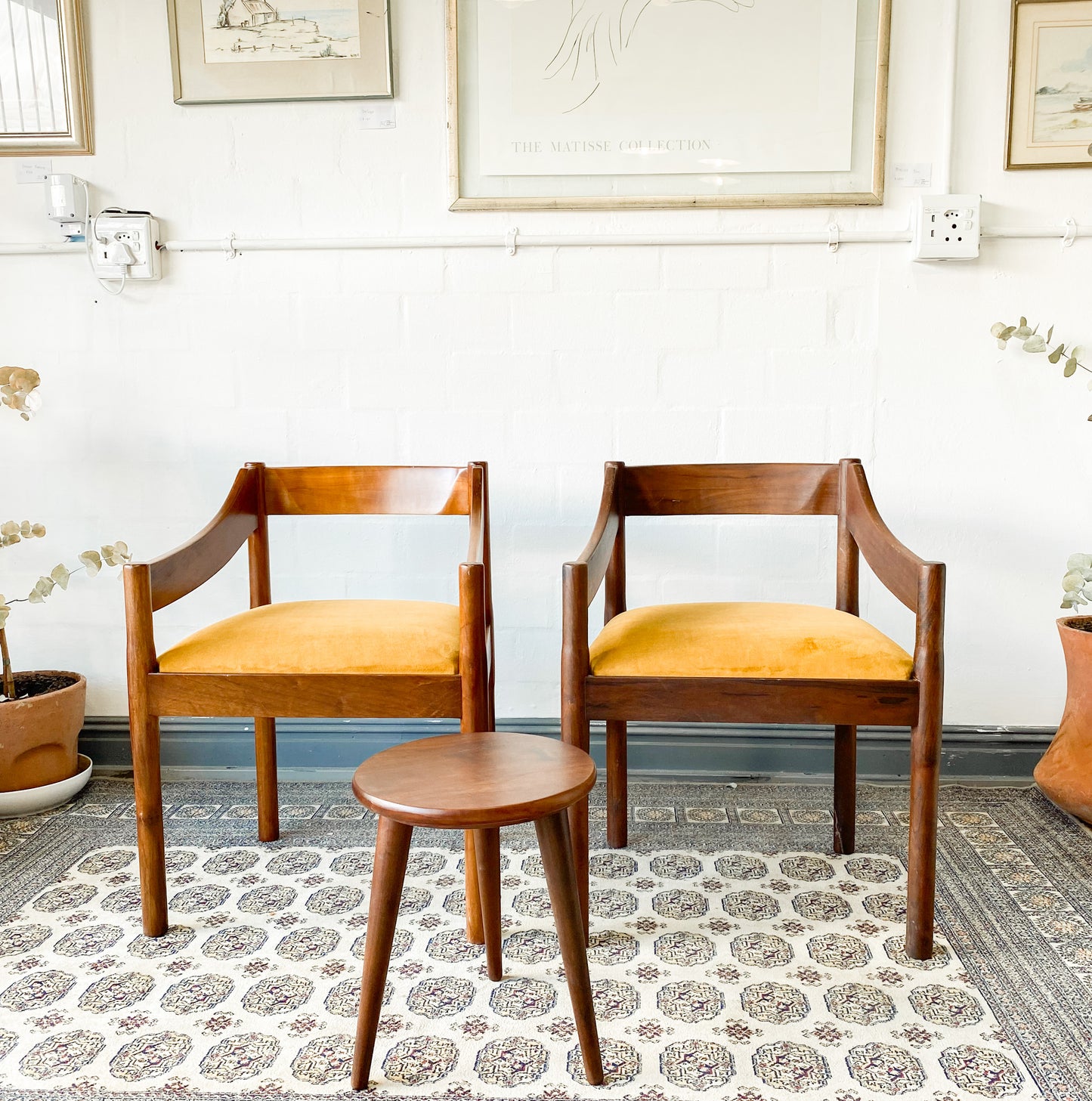 Set of two solid wood Mid-Century Modern Arm Chairs and side table.
