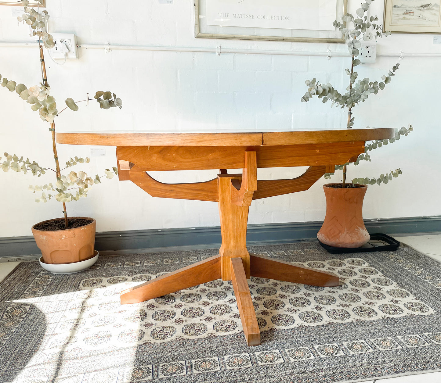 Mid-Century Modern Extendable dining table suitable to seat 6-8 guests.