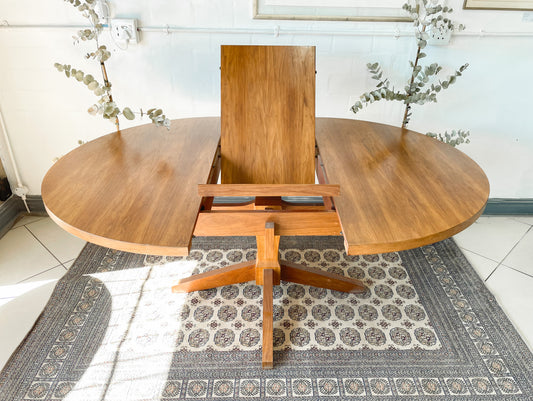 Mid-Century Modern Extendable dining table suitable to seat 6-8 guests.