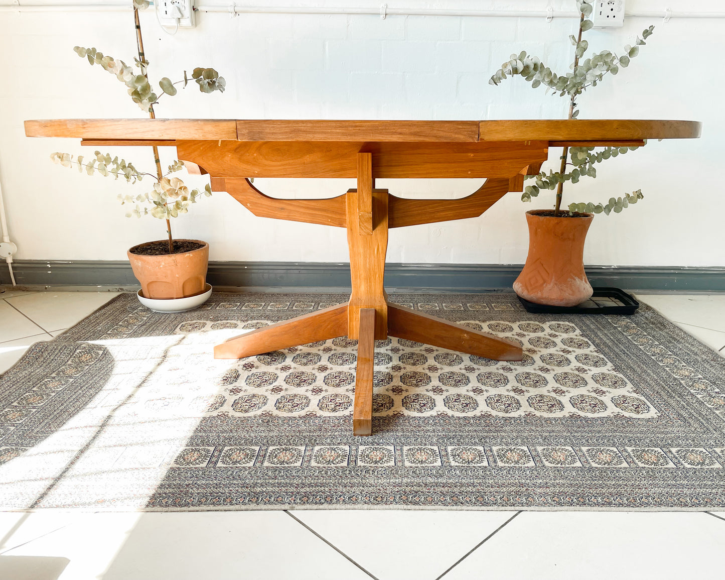 Mid-Century Modern Extendable dining table suitable to seat 6-8 guests.