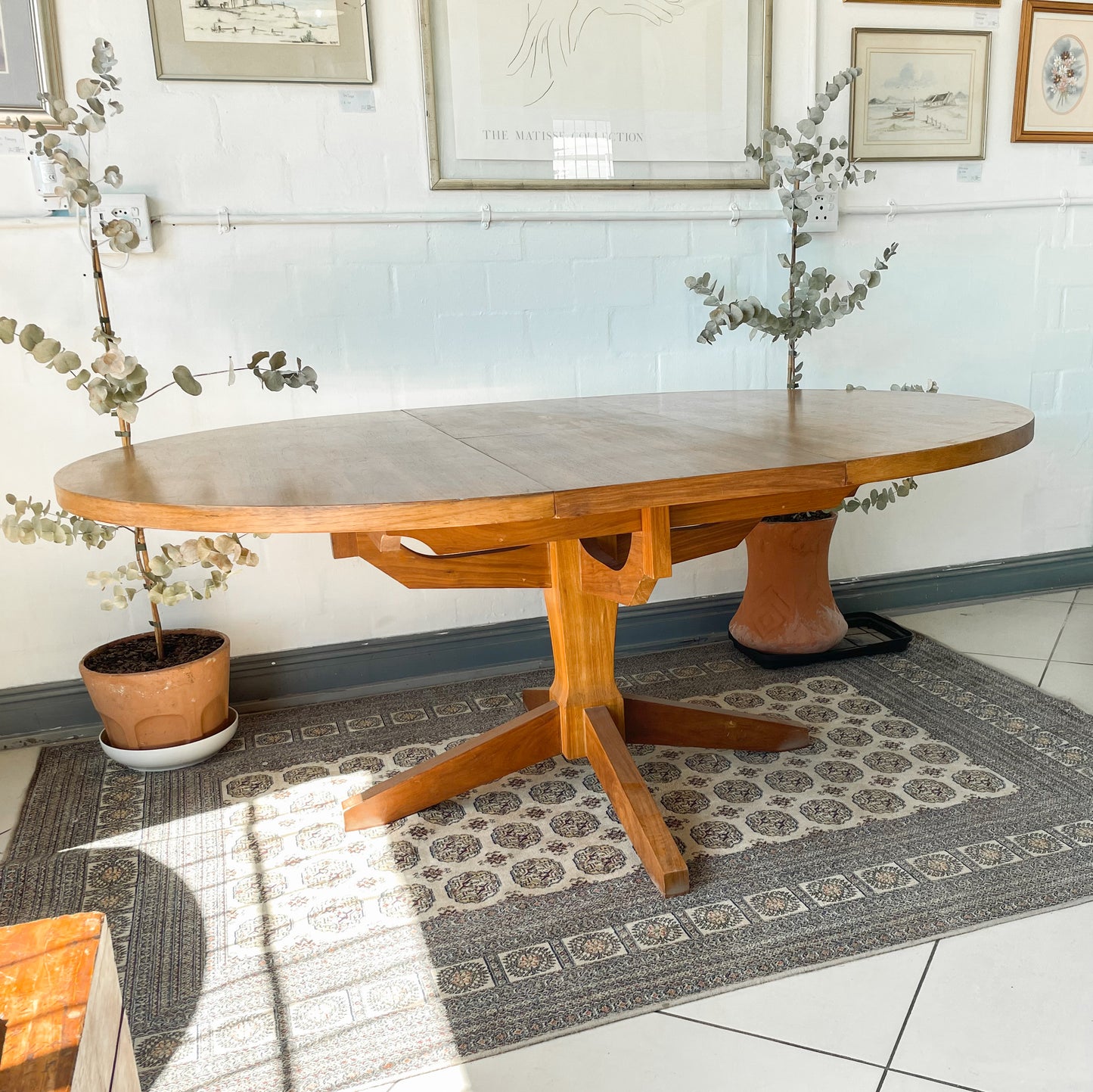 Mid-Century Modern Extendable dining table suitable to seat 6-8 guests.