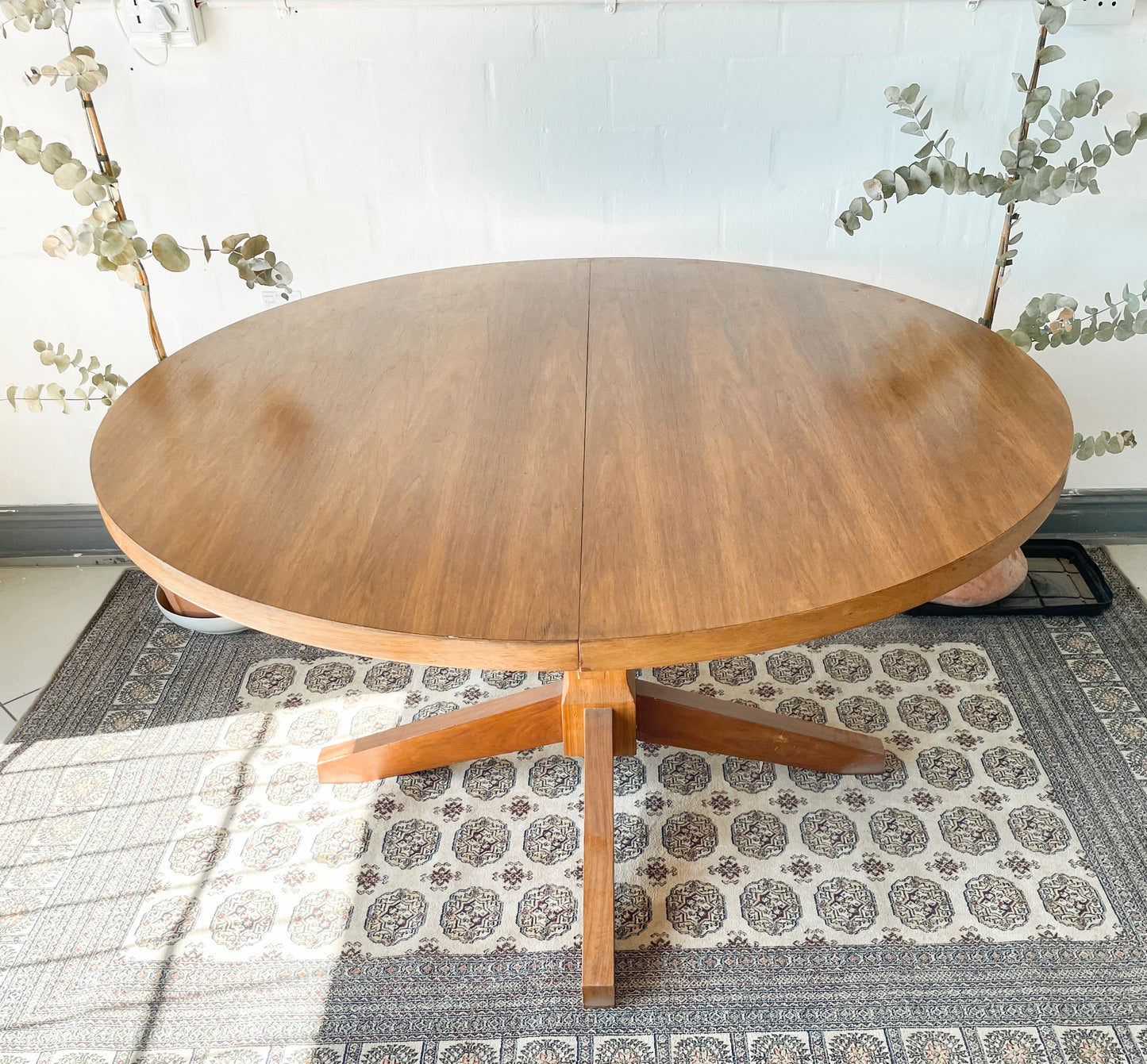 Mid-Century Modern Extendable dining table suitable to seat 6-8 guests.