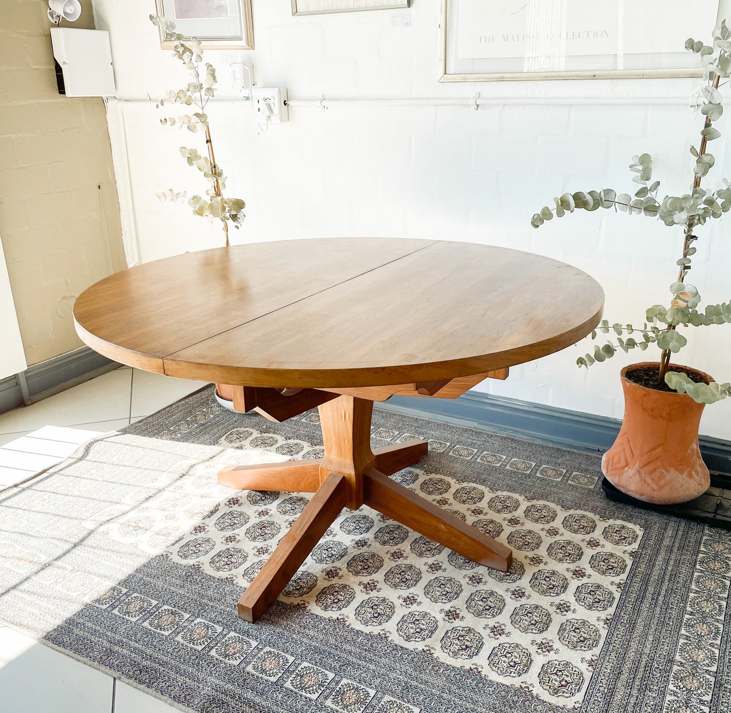 Mid-Century Modern Extendable dining table suitable to seat 6-8 guests.