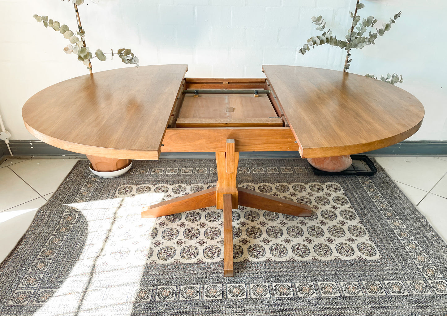 Mid-Century Modern Extendable dining table suitable to seat 6-8 guests.
