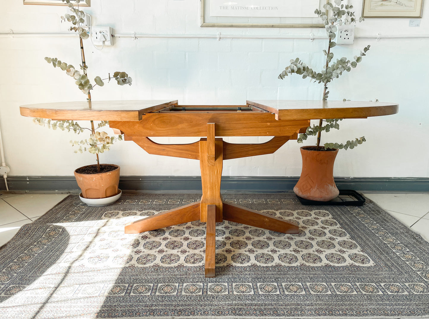 Mid-Century Modern Extendable dining table suitable to seat 6-8 guests.